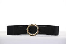 Load image into Gallery viewer, Elevate your style to new heights with the Frank Lyman Black and Gold Statement Buckle Belt. This stunning accessory features a bold circular buckle adorned with dazzling metallic accents, adding a touch of glamour and sophistication to any outfit. This belt offers durability, flexibility, and a comfortable fit. Perfect for cinching dresses, blazers, or tunics, this versatile belt effortlessly transitions from casual to formal ensembles.