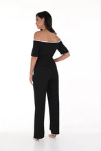 Load image into Gallery viewer, This jumpsuit effortlessly blends refined elegance with contemporary style, showcasing a sleek off-shoulder design in black with off-white contrast stitching. The belted waist accentuates the silhouette, making it a versatile and fashionable choice for any event.