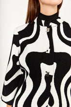 Load image into Gallery viewer, This amazing jacket features a bold abstract print in classic black and white colors. Designed with three quarter sleeves and collarless neck, this modern Frank Lyman design offers a professional and vogue look. Wear it on its own, or over a dress, cardigan, or top for a stylish look This brilliant style is perfect for the office, a social event, or a night out. Color- Black and white. Square button down. No pockets. Abstract print. Three quarter sleeves. Slight stretch fabrication.