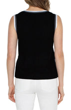 Load image into Gallery viewer, The Sherese Sleeveless V-Neck Sweater from Liverpool Los Angeles offers a luxurious black fabric with a comfortable and smooth texture. It includes a striking white ribbed accent for added style. For a trendy and coordinated look, pair it with the Oralia Open Front Contrast Trim Cardigan. Color- Black and white. Sleeveless sweater. V-neck. Contrasting rib trim. 12 Gauge Rib.