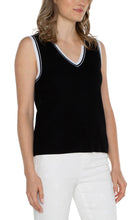 Load image into Gallery viewer, The Sherese Sleeveless V-Neck Sweater from Liverpool Los Angeles offers a luxurious black fabric with a comfortable and smooth texture. It includes a striking white ribbed accent for added style. For a trendy and coordinated look, pair it with the Oralia Open Front Contrast Trim Cardigan. Color- Black and white. Sleeveless sweater. V-neck. Contrasting rib trim. 12 Gauge Rib.