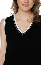 Load image into Gallery viewer, The Sherese Sleeveless V-Neck Sweater from Liverpool Los Angeles offers a luxurious black fabric with a comfortable and smooth texture. It includes a striking white ribbed accent for added style. For a trendy and coordinated look, pair it with the Oralia Open Front Contrast Trim Cardigan. Color- Black and white. Sleeveless sweater. V-neck. Contrasting rib trim. 12 Gauge Rib.