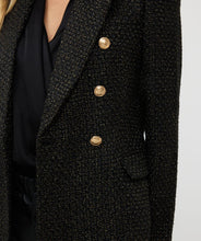 Load image into Gallery viewer, Elevate your style with the Brigida Boucle Blazer Long by EsQualo. The shimmering gold lurex and chic gold buttons add a touch of sophistication to this versatile piece, perfect for any wardrobe. Its classic boucle fabric provides both texture and warmth, while its long silhouette allows for effortless layering.