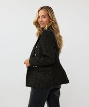 Load image into Gallery viewer, Elevate your style with the Brigida Boucle Blazer Long by EsQualo. The shimmering gold lurex and chic gold buttons add a touch of sophistication to this versatile piece, perfect for any wardrobe. Its classic boucle fabric provides both texture and warmth, while its long silhouette allows for effortless layering.