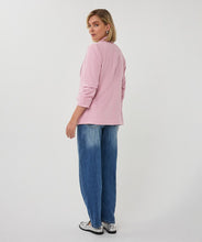 Load image into Gallery viewer, Woman wearing a pink blazer and blue jeans on a white background.