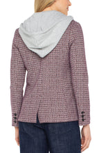Load image into Gallery viewer, Woman wearing a patterned blazer with a hood and blue jeans on a white background.