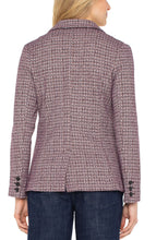 Load image into Gallery viewer, Model wearing a patterned blazer and blue jeans against a white background.
