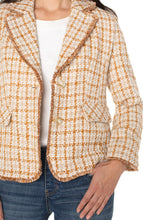 Load image into Gallery viewer, Woman wearing a gold plaid blazer and jeans against a white background.