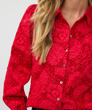 Load image into Gallery viewer, Featuring a raised floral pattern and a bold red hue, the Brandee Blouse 2tone Flower Jacquard by EsQualo is a must-have for those looking to make a statement. The thicker fabric is perfect for colder days, and can easily be dressed up with a skirt, trousers, or even your favorite denim. Don't miss out on leaving a lasting impression with this chic and unforgettable blouse.