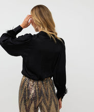 Load image into Gallery viewer, The Briet Blouse Basic Satin Feathers from EsQualo is a sophisticated and stylish top suitable for any event. Crafted with a timeless satin texture and featuring detachable feather cuffs, it can be dressed up for a party-ready look or worn as a versatile piece. Made with 100% viscose, it is both lightweight and comfortable for all-day wear.