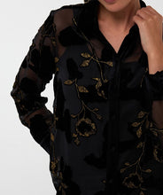 Load image into Gallery viewer, A sheer black blouse with black velour floral pattern and gold lurex threading against a white background.