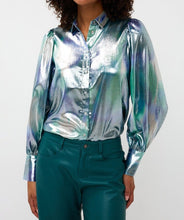 Load image into Gallery viewer, Model wearing a teal, blue and silver blouse with teal pants against a white background.