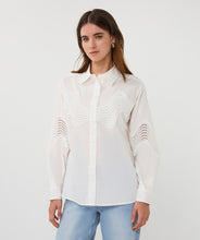 Load image into Gallery viewer, Woman wearing an off-white blouse with lace detailing and blue jeans against a plain background.