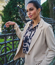 Load image into Gallery viewer, The exquisite Harmony print Blooma Blouse Mesh by EsQualo features faux pockets and gold buttons on the front, as well as a stunning abstract design in tan and black. With a double-layered construction to prevent transparency and button cuffs, this versatile top perfectly complements black pants, skirts, and jeans. Pair it with our Tanner Trousers Cargo City - EsQualo W2410709 for a chic and timeless look.