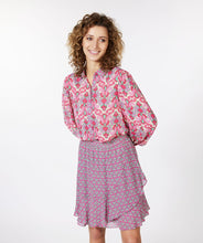 Load image into Gallery viewer, Our Macy multi print blouse is a lovely combination of jade green and pink abstract floral patterns. Lovely and unique, you will stand out in a crowd when you wear this beauty. Easily pairs with denim and skirts and can be dressed up or worn casually. Style with our FALLON FLAIR JEAN IN JADE COLOR- ESQUALO for the perfect colorful look! Colors- Pinks and jade green. Button down. Abstract floral print. Lightweight, slightly sheer. Fabric-100% Viscose.