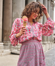 Load image into Gallery viewer, Our Macy multi print blouse is a lovely combination of jade green and pink abstract floral patterns. Lovely and unique, you will stand out in a crowd when you wear this beauty. Easily pairs with denim and skirts and can be dressed up or worn casually. Style with our FALLON FLAIR JEAN IN JADE COLOR- ESQUALO for the perfect colorful look! Colors- Pinks and jade green. Button down. Abstract floral print. Lightweight, slightly sheer. Fabric-100% Viscose.