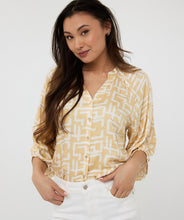 Load image into Gallery viewer, Brighten up your wardrobe with this lightweight shimmer blouse from EsQualo. The Eta Blouse features relaxed raglan three quarter sleeves, v-neckline, and a straight hem for an easy, untucked fit. Its soft, metallic sheen adds a touch of radiance, making it just as perfect for laid-back brunches as it is for polished workwear looks. Effortlessly stylish and breezy, it layers beautifully under blazers or shines on its own with denim and heels.