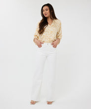 Load image into Gallery viewer, Brighten up your wardrobe with this lightweight shimmer blouse from EsQualo. The Eta Blouse features relaxed raglan three quarter sleeves, v-neckline, and a straight hem for an easy, untucked fit. Its soft, metallic sheen adds a touch of radiance, making it just as perfect for laid-back brunches as it is for polished workwear looks. Effortlessly stylish and breezy, it layers beautifully under blazers or shines on its own with denim and heels.