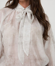 Load image into Gallery viewer, Off-white color blouse with tie detail against a white background.