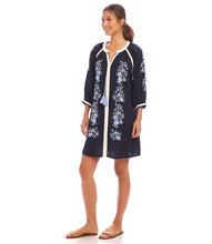 Load image into Gallery viewer, The Basilia Blouson Sleeve Embroidered Peasant Dress by Karen Kane is a beautifully crafted piece that blends boho-chic elegance with effortless comfort. Designed in a rich navy hue, this dress features intricate embroidery detailing and a tassel tie neckline, adding a charming touch to its relaxed silhouette. The blouson sleeves enhance its flowy appeal, making it perfect for seasonal transitions.
