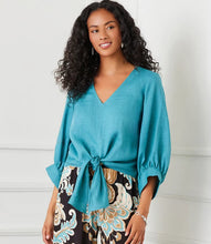 Load image into Gallery viewer, Stay cool and chic with the Bobbi Blouson Sleeve Linen Tie-Front Top in Aqua. Made from 100% lightweight linen, this top exudes effortless elegance. The airy blouson sleeves lend a graceful touch, while the tie-front detail allows for a flattering, adjustable fit. Its vibrant aqua color adds a refreshing and lively charm, making it a perfect choice for warmer days.