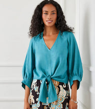 Load image into Gallery viewer, Stay cool and chic with the Bobbi Blouson Sleeve Linen Tie-Front Top in Aqua. Made from 100% lightweight linen, this top exudes effortless elegance. The airy blouson sleeves lend a graceful touch, while the tie-front detail allows for a flattering, adjustable fit. Its vibrant aqua color adds a refreshing and lively charm, making it a perfect choice for warmer days.
