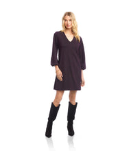 Load image into Gallery viewer, Woman wearing a dark purple and metallic dress and tall black boots against a white background.