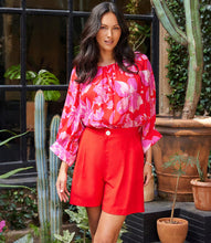 Load image into Gallery viewer, This top features blouson sleeves that add a playful element of movement, exuding a sense of effortless sophistication. Crafted from soft, comfortable viscose fabric, the delicate floral print adds a touch of romantic allure, making it an ideal choice for adding a pop of color to any outfit.