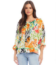 Load image into Gallery viewer, Experience the enchanting and whimsical feel of a floral garden with the Paiden Print Blouson Sleeve Top by Karen Kane. This expertly crafted top boasts a graceful crepe fabric that provides both comfort and style. The relaxed and laid-back attitude is enhanced by the blouson sleeves, making it a must-have addition to any wardrobe.
