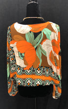 Load image into Gallery viewer, This gorgeous, flowy top showcases exquisite blouson sleeves for a touch of refinement and fashionable touch. Its relaxed fit allows for comfortable wear throughout the day, and the stunning multi print makes it a versatile piece to pair with black trousers or your favorite denim.