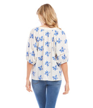 Load image into Gallery viewer, Lightweight cotton gives a breezy quality to this peasant top detailed with charming floral embroidery. It's finished with statement-making puff sleeves. Colors- Off white and blue. Short sleeve. Button down. Floral embroidery.