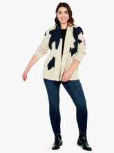 Load image into Gallery viewer, A super comfy classic shaker knit with a few modern touches. The details start at the yarn, where the dominant oatmeal color is accented by flecks of yellow and charcoal to add even more texture and interest. The intarsia knit blocks of black and pink do the rest. A slightly chunkier weight plus the shawl collar and extra length means it's perfect as an outer layer on crisper days. Color-Neutral Multi - oatmeal, (flecks of yellow and charcoal) black, pink. Intarsia knitting. Heavier weight.