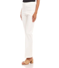 Load image into Gallery viewer, Model wearing off-white pants, black top and tan heeled sandals against a white background.
