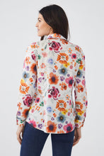Load image into Gallery viewer, This vibrant top is a must-have for the upcoming seasons of spring and summer. Featuring a bold floral print set against a crisp white background, this long sleeve shirt can be dressed up or down with ease. Simply tie it at the waist and pair with shorts for a casual look or elevate an outfit by pairing with trousers for a standout office ensemble.