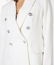 Load image into Gallery viewer, This amazing boucle blazer in white is absolutely stunning in person. Sophisticated and charming, our Willa blazer is a Chanel inspired design with decorative buttons that provide a rich look. Dress up or wear with denim, this blazer will elevate any look. Color- White. Boucle fabrication. Comfortable fit. Longer style. Silver buttons Front functional pockets.