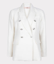 Load image into Gallery viewer, This amazing boucle blazer in white is absolutely stunning in person. Sophisticated and charming, our Willa blazer is a Chanel inspired design with decorative buttons that provide a rich look. Dress up or wear with denim, this blazer will elevate any look. Color- White. Boucle fabrication. Comfortable fit. Longer style. Silver buttons Front functional pockets.