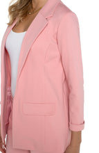 Load image into Gallery viewer, A classic piece, boyfriend blazers are always in style. Now, you can own a boyfriend blazer in a fabulous pastel pink color! Sleek and sophisticated, this gorgeous blazer is incredibly versatile as a part of a suit or matched with your favorite denim. Be prepared to receive compliments when you wear this beauty! Color - Pink perfection. Princess dart styling. Two front flap pockets. Sleek modern style and a relaxed fit. Fabric -54% Rayon. 35% Nylon. 11% Spandex.
