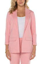 Load image into Gallery viewer, A classic piece, boyfriend blazers are always in style. Now, you can own a boyfriend blazer in a fabulous pastel pink color! Sleek and sophisticated, this gorgeous blazer is incredibly versatile as a part of a suit or matched with your favorite denim. Be prepared to receive compliments when you wear this beauty! Color - Pink perfection. Princess dart styling. Two front flap pockets. Sleek modern style and a relaxed fit. Fabric -54% Rayon. 35% Nylon. 11% Spandex.