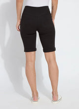 Load image into Gallery viewer, The Lyssé Boyfriend Short is a stylish and comfortable denim short designed for a relaxed yet polished look. Crafted with Lyssé Fit 360° Smoothing technology, these shorts offer 4-way stretch for ultimate flexibility and comfort. The concealed patented waistband ensures a flattering fit, while the slightly relaxed thigh provides ease of movement.