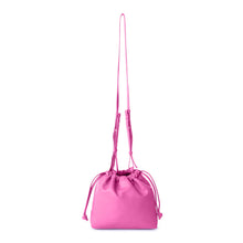 Load image into Gallery viewer, This stylish bucket bag is spacious, perfect for carrying all the essentials when you're on the go! It also features a removable and adjustable strap for easy carrying. Constructed from ultra-soft vegan leather, this bag is sure to have heads turning! Color- Fuchsia. Removable strap. Interior slit pocket. Vegan leather. Drawstring closure. Measurements--11.5’’ x 3’‘x 6’