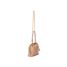 Load image into Gallery viewer, This stylish bucket bag is spacious, perfect for carrying all the essentials when you're on the go! It also features a removable and adjustable strap for easy carrying. Constructed from ultra-soft vegan leather, this bag is sure to have heads turning! Color- Latte. Removable strap. Interior slit pocket. Vegan leather. Drawstring closure.