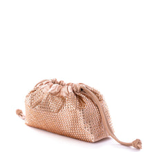 Load image into Gallery viewer, This spacious bag is perfect for carrying all of your essentials when you're on the go! Constructed with luxurious vegan leather, you can remove the chain for a chic, minimalistic clutch look. Effortlessly transition your look from day to night with this stylish bag. Color- Champagne. Drawstring closure. Crystals. Removable chain. Interior slit pocket. Vegan leather. PETA certified.