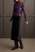 Load image into Gallery viewer, Our Blessyn Bright Violet Lined Turtleneck Top offers the perfect blend of comfort fused with contemporary style. Made from high quality, this turtleneck boasts a striking abstract design combining floral and animal prints, bringing a unique flair to your daily attire. Perfect for laid-back events or elegant affairs, this colorful top is sure to be a highlight in any trendsetting wardrobe.