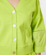 Load image into Gallery viewer, A brilliant lime color pops on this summery sweatshirt fabric cardigan by EsQualo. Add embroidery detailing on half the sleeve, and you have a fabulous and unique statement piece that will give you attention and compliments. Color -Lime. Button down. Sleeve embroidery. Sweatshirt fabrication.