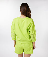 Load image into Gallery viewer, A brilliant lime color pops on this summery sweatshirt fabric cardigan by EsQualo. Add embroidery detailing on half the sleeve, and you have a fabulous and unique statement piece that will give you attention and compliments. Color -Lime. Button down. Sleeve embroidery. Sweatshirt fabrication.