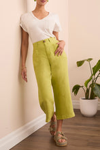 Load image into Gallery viewer, Elevate your wardrobe with the Tribal Brooke Flowy Wide Crop Pants, designed for effortless movement and breezy sophistication. Crafted from a lightweight linen-blend fabric, these pants offer a relaxed fit with a high-rise waist, ensuring all-day comfort and a flattering silhouette. The wide-leg design adds a modern touch, while the cropped length makes them perfect for warm-weather styling. Whether paired with a fitted blouse for a polished look or a casual tee for laid-back elegance, these pants are a ve