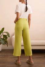 Load image into Gallery viewer, Elevate your wardrobe with the Tribal Brooke Flowy Wide Crop Pants, designed for effortless movement and breezy sophistication. Crafted from a lightweight linen-blend fabric, these pants offer a relaxed fit with a high-rise waist, ensuring all-day comfort and a flattering silhouette. The wide-leg design adds a modern touch, while the cropped length makes them perfect for warm-weather styling. Whether paired with a fitted blouse for a polished look or a casual tee for laid-back elegance, these pants are a ve