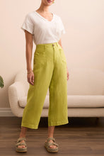 Load image into Gallery viewer, Elevate your wardrobe with the Tribal Brooke Flowy Wide Crop Pants, designed for effortless movement and breezy sophistication. Crafted from a lightweight linen-blend fabric, these pants offer a relaxed fit with a high-rise waist, ensuring all-day comfort and a flattering silhouette. The wide-leg design adds a modern touch, while the cropped length makes them perfect for warm-weather styling. Whether paired with a fitted blouse for a polished look or a casual tee for laid-back elegance, these pants are a ve