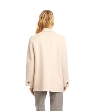 Load image into Gallery viewer, Woman wearing an oatmeal overcoat over an oatmeal v-neck top and striped pants against a white background.