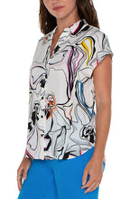 Load image into Gallery viewer, This elegant button-front blouse boasts a stylish dolman sleeve design, complete with a classic collar. Its eye-catching print adds a touch of charm, making it a versatile choice for pairing with denim or dress pants for a timeless appeal. Color- White, black, Button-front closure. Dolman sleeves. Collared. 27" HPS. Liverpool Exclusive Print.